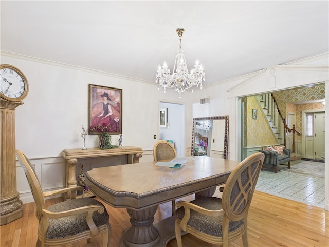 150 Central Ave, Johnston, RI 02919 - dining room featuring a chandelier, stairs, light wood-type flooring, and ornamental molding