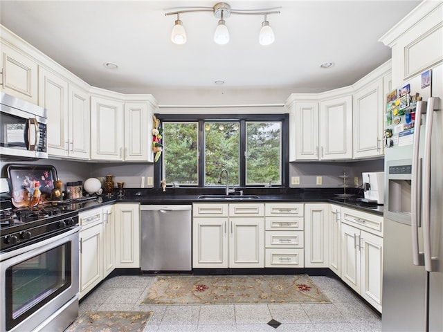 150 Central Ave, Johnston, RI 02919 - kitchen featuring appliances with stainless steel finishes, dark countertops, granite tiled floors, and recessed lighting
