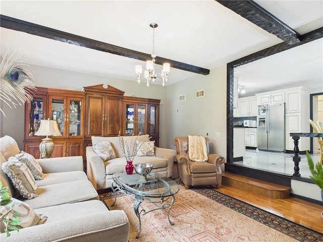 150 Central Ave, Johnston, RI 02919 - living area featuring beam ceiling, a chandelier, and light wood-style floors