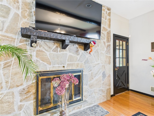 150 Central Ave, Johnston, RI 02919 - detailed view of wood finished floors and a stone fireplace