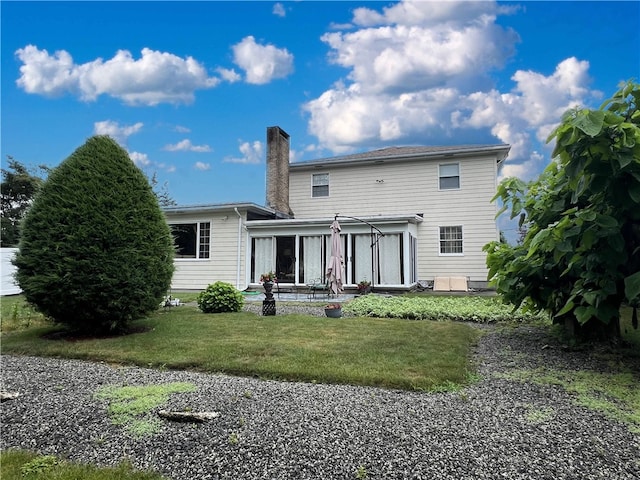 150 Central Ave, Johnston, RI 02919 - rear view of house featuring a chimney, a lawn, and a sunroom