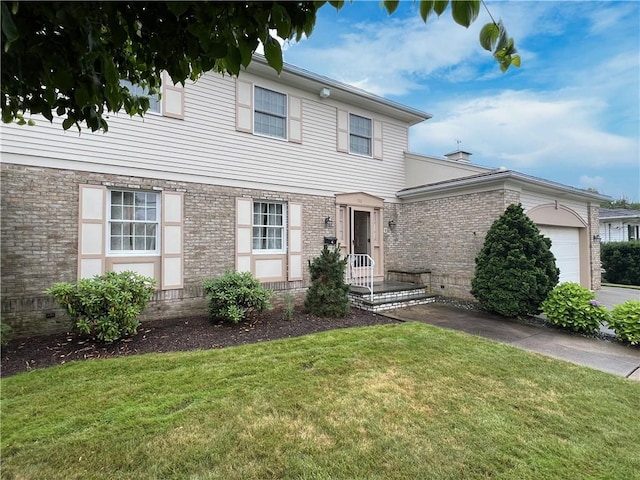 150 Central Ave, Johnston, RI 02919 - view of front of home with a garage, a front lawn, and brick siding