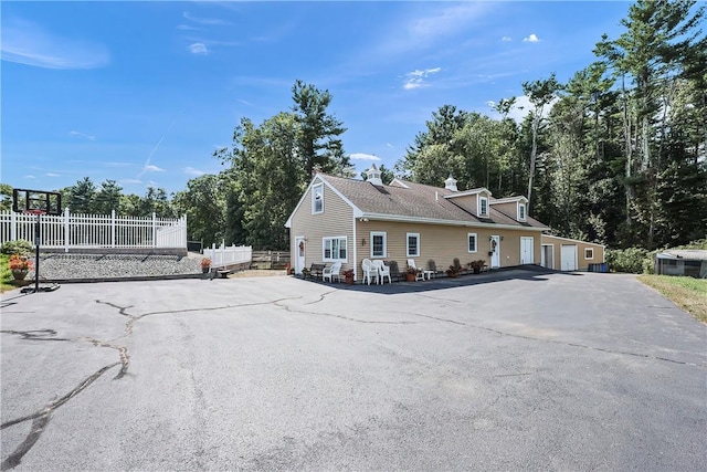 240 Smith St, Attleboro, MA 02703 - view of side of home with a chimney and view of scattered trees