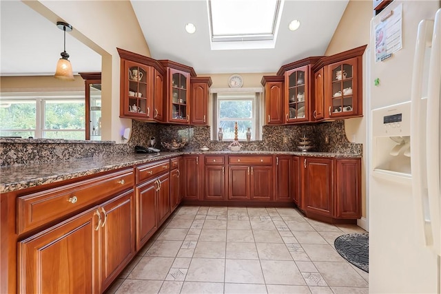 240 Smith St, Attleboro, MA 02703 - kitchen featuring white fridge with ice dispenser, tasteful backsplash, dark stone countertops, glass insert cabinets, and lofted ceiling