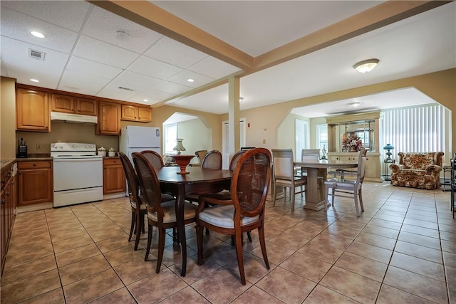 240 Smith St, Attleboro, MA 02703 - dining area featuring light tile patterned floors, arched walkways, and recessed lighting