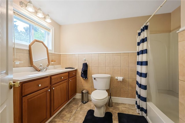 240 Smith St, Attleboro, MA 02703 - full bath with vanity, tile patterned floors, tile walls, shower / bathtub combination with curtain, and a wainscoted wall