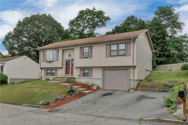 8 Gale Ct, North Providence, RI 02904 - split foyer home featuring a garage, asphalt driveway, and cooling unit
