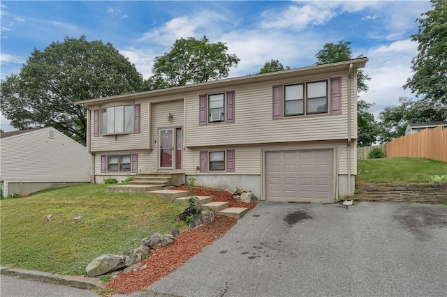 8 Gale Ct, North Providence, RI 02904 - bi-level home featuring an attached garage, driveway, and cooling unit