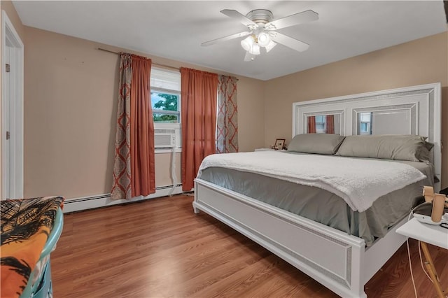 8 Gale Ct, North Providence, RI 02904 - bedroom with a baseboard heating unit, light wood-style flooring, and ceiling fan