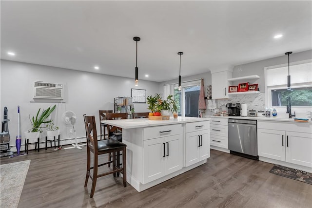 8 Gale Ct, North Providence, RI 02904 - kitchen with dishwasher, tasteful backsplash, a wall mounted air conditioner, light countertops, and dark wood-type flooring