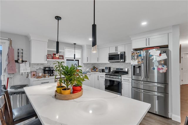 8 Gale Ct, North Providence, RI 02904 - kitchen featuring appliances with stainless steel finishes, tasteful backsplash, white cabinetry, and recessed lighting