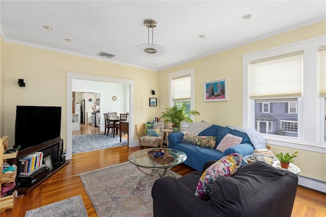 179 Cole Ave Unit 2, Providence, RI 02906 - living area featuring a baseboard radiator, crown molding, and wood finished floors