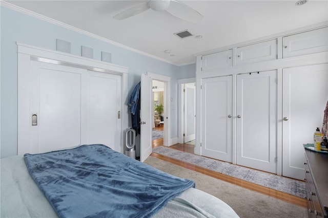 179 Cole Ave Unit 2, Providence, RI 02906 - bedroom with ornamental molding, two closets, and a ceiling fan