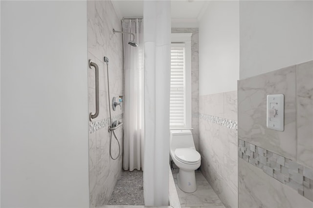 179 Cole Ave Unit 2, Providence, RI 02906 - bathroom featuring tile walls, walk in shower, and a wainscoted wall
