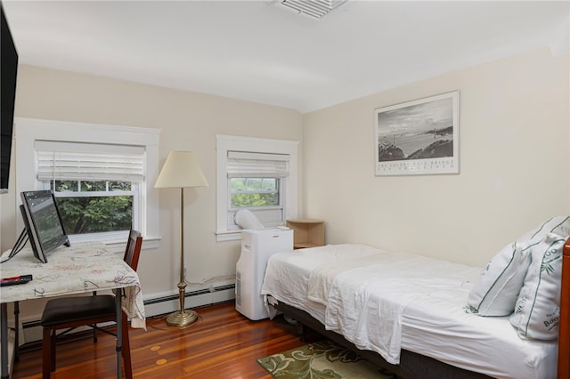 179 Cole Ave Unit 2, Providence, RI 02906 - bedroom with a baseboard heating unit, wood finished floors, and a desk