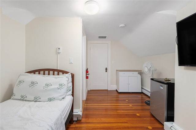 179 Cole Ave Unit 2, Providence, RI 02906 - bedroom featuring fridge, wood finished floors, a baseboard heating unit, and vaulted ceiling