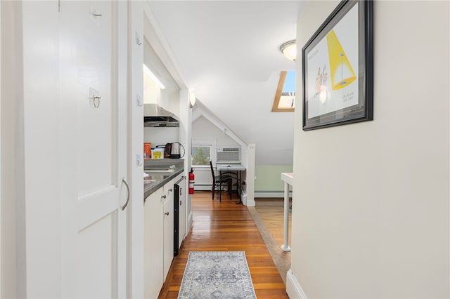 179 Cole Ave Unit 2, Providence, RI 02906 - hall with wood finished floors, a wall mounted air conditioner, a baseboard radiator, and lofted ceiling