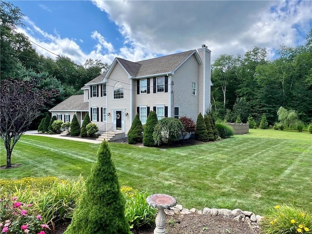 35 E Lantern Rd, Smithfield, RI 02917 - colonial house with a chimney, a front yard, and a shingled roof