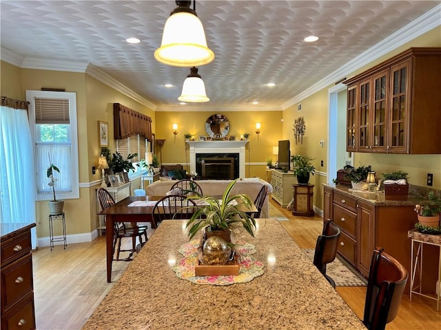 35 E Lantern Rd, Smithfield, RI 02917 - dining area with light wood-style flooring, a fireplace, crown molding, and recessed lighting