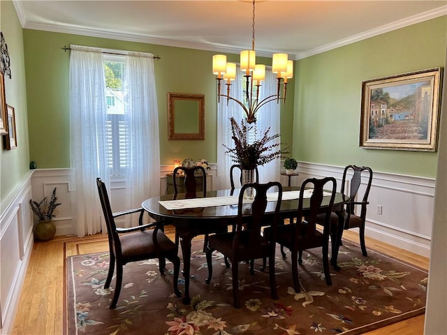 35 E Lantern Rd, Smithfield, RI 02917 - dining space with a chandelier, wood finished floors, a decorative wall, crown molding, and wainscoting