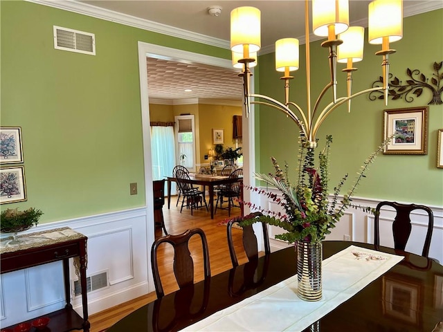 35 E Lantern Rd, Smithfield, RI 02917 - dining space with crown molding, a wainscoted wall, wood finished floors, and a decorative wall