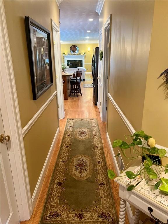 35 E Lantern Rd, Smithfield, RI 02917 - corridor with light wood finished floors and ornamental molding