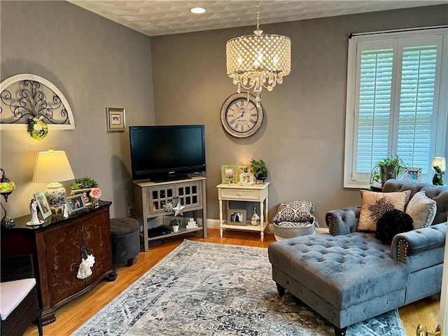35 E Lantern Rd, Smithfield, RI 02917 - living room with healthy amount of natural light, a chandelier, and light wood finished floors