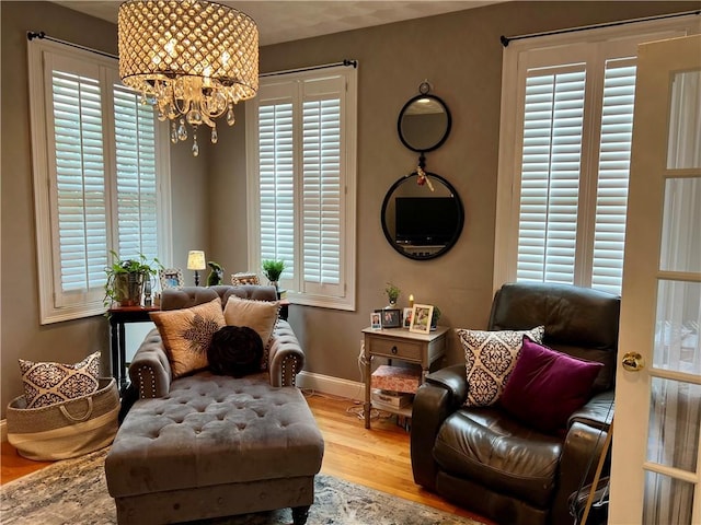 35 E Lantern Rd, Smithfield, RI 02917 - sitting room with a chandelier and wood finished floors