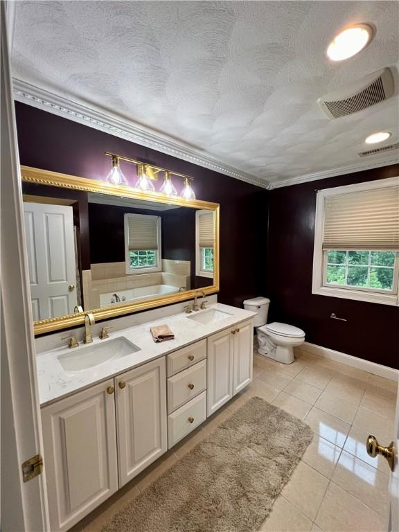 35 E Lantern Rd, Smithfield, RI 02917 - bathroom with tile patterned floors, double vanity, a garden tub, and a textured ceiling