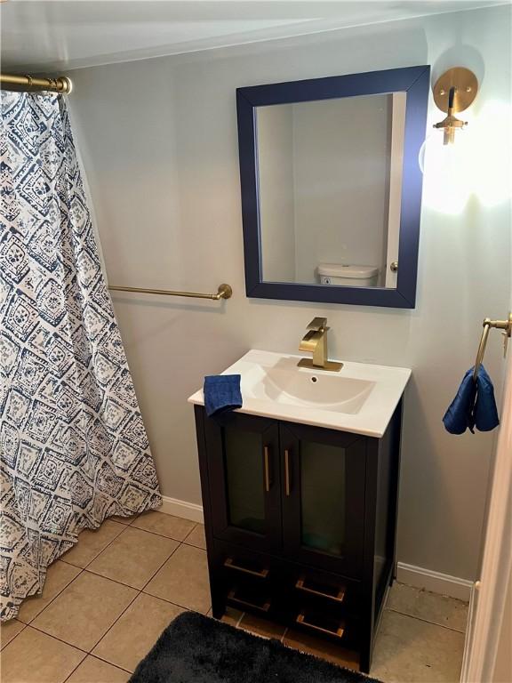 35 E Lantern Rd, Smithfield, RI 02917 - full bathroom with vanity, tile patterned floors, and a shower with shower curtain