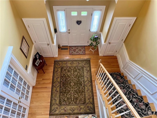 35 E Lantern Rd, Smithfield, RI 02917 - foyer with light wood-style flooring and stairs