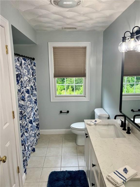 35 E Lantern Rd, Smithfield, RI 02917 - full bath with vanity, tile patterned floors, and a shower with shower curtain