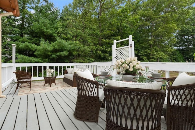 29 Teakwood Dr W, Coventry, RI 02816 - wooden deck with an outdoor living space and view of scattered trees