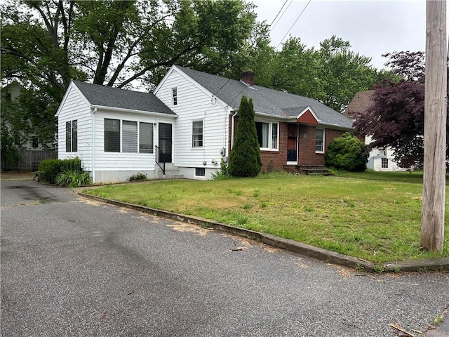 12 Oakland Ave, Johnston, RI 02919 - ranch-style home featuring entry steps, a front lawn, and brick siding