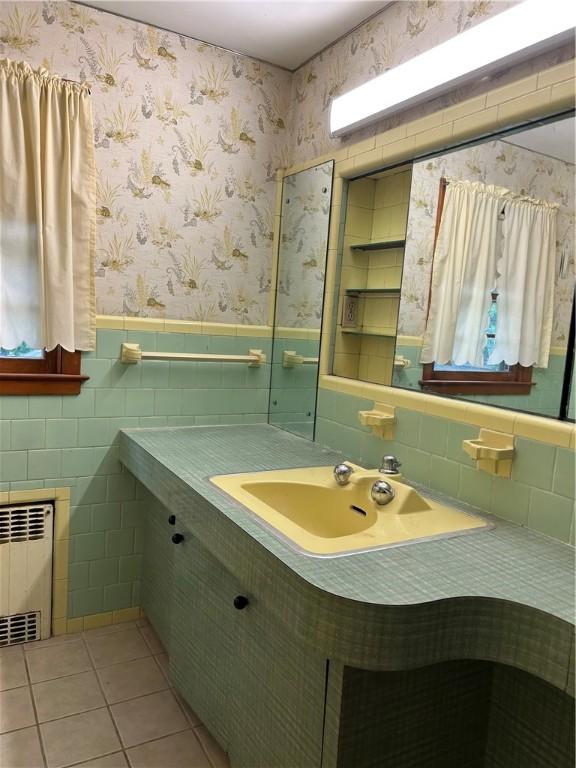 12 Oakland Ave, Johnston, RI 02919 - bathroom with radiator heating unit, tile patterned flooring, and vanity