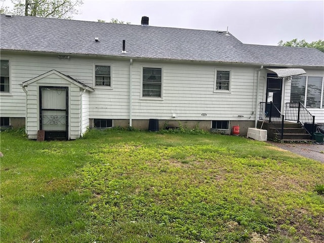 12 Oakland Ave, Johnston, RI 02919 - back of house with a lawn and a shingled roof