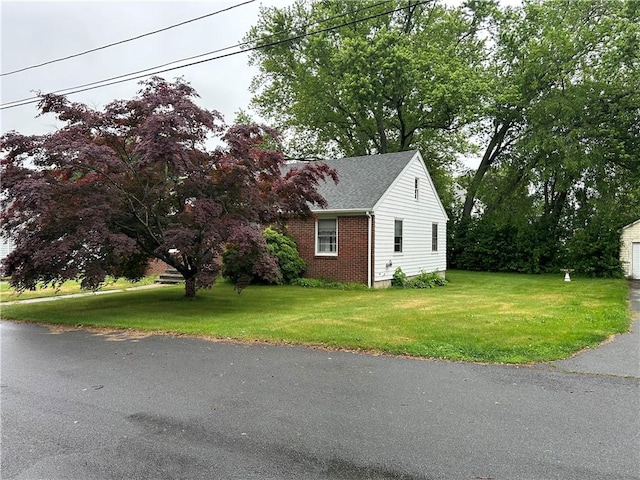 12 Oakland Ave, Johnston, RI 02919 - view of property exterior with a lawn, brick siding, and a shingled roof