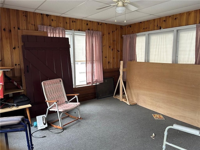 12 Oakland Ave, Johnston, RI 02919 - unfurnished room featuring a ceiling fan, carpet floors, wood walls, and a paneled ceiling