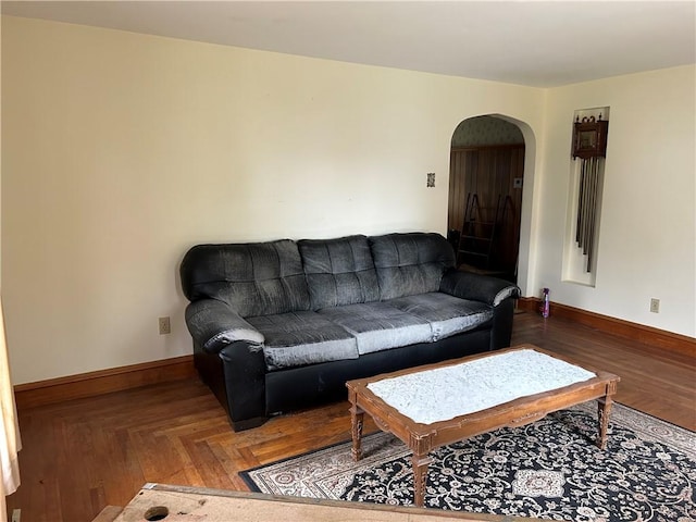 12 Oakland Ave, Johnston, RI 02919 - living area featuring arched walkways and baseboards