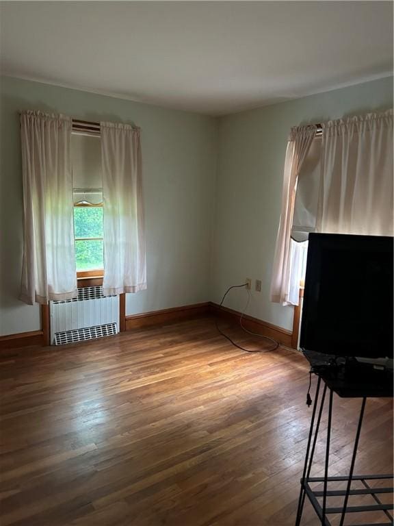 12 Oakland Ave, Johnston, RI 02919 - unfurnished room featuring radiator heating unit and wood-type flooring