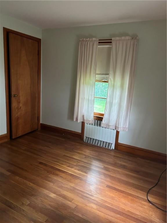 12 Oakland Ave, Johnston, RI 02919 - spare room featuring radiator and wood finished floors