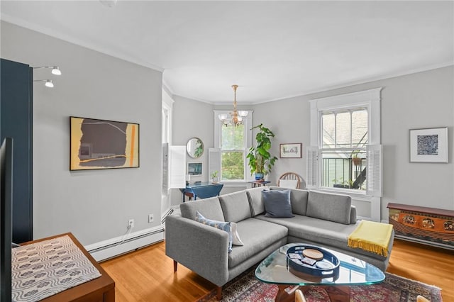 303 Angell St Unit 3, Providence, RI 02906 - living area featuring wood finished floors, a chandelier, ornamental molding, and a baseboard heating unit