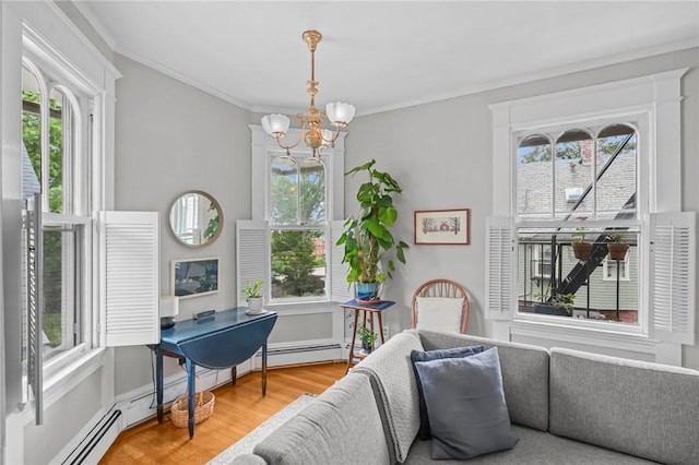 303 Angell St Unit 3, Providence, RI 02906 - sitting room with wood finished floors, a chandelier, ornamental molding, and a baseboard radiator