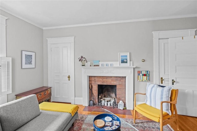 303 Angell St Unit 3, Providence, RI 02906 - living room featuring crown molding, a brick fireplace, and wood finished floors
