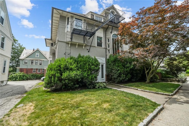 303 Angell St Unit 3, Providence, RI 02906 - view of front of house featuring a front yard and a balcony