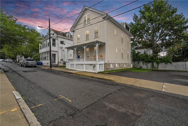 13 Dean Ave, Newport, RI 02840 - view of front facade with a porch