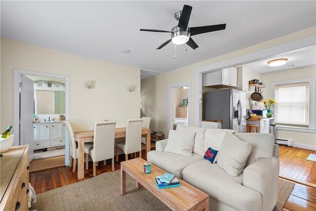13 Dean Ave, Newport, RI 02840 - living area featuring baseboard heating, wood-type flooring, and a ceiling fan