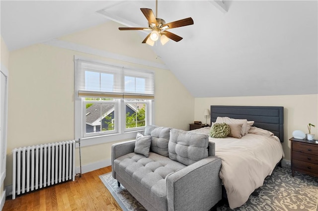 13 Dean Ave, Newport, RI 02840 - bedroom with radiator, lofted ceiling, wood finished floors, and ceiling fan