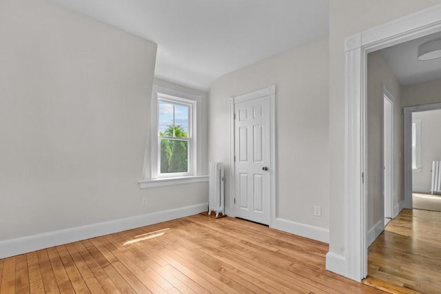 11 Taft St, Coventry, RI 02816 - unfurnished bedroom with radiator and light wood-type flooring