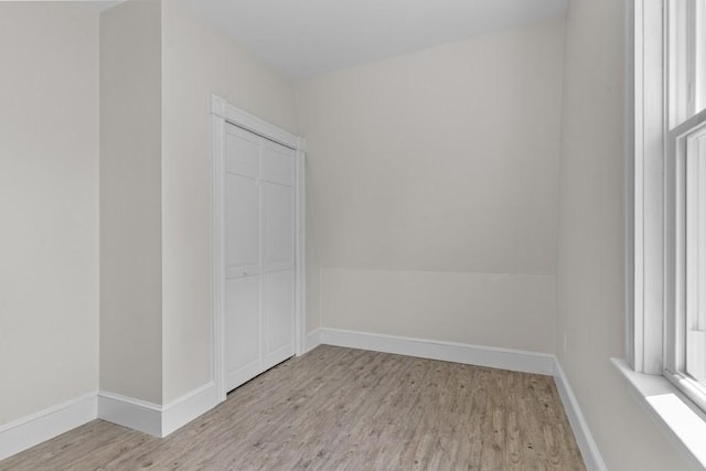 11 Taft St, Coventry, RI 02816 - empty room with light wood-style flooring and baseboards